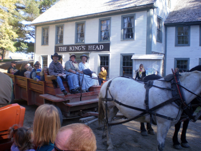 Horse Drawn Wagon with passengers.